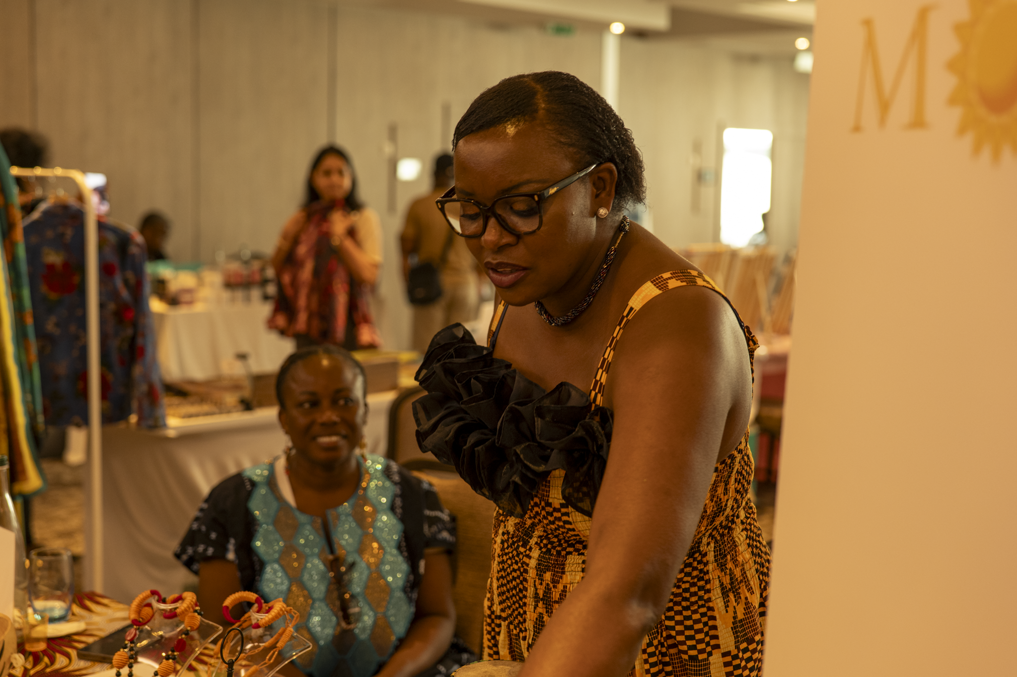 Market stall with kente-style clothing
